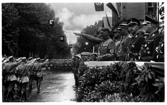 Adolf Hitler salutes the parade of the Westphalian SA in Dortmund